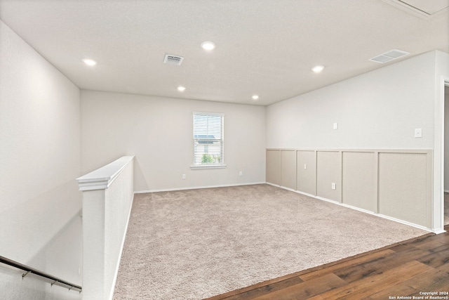 spare room with hardwood / wood-style flooring