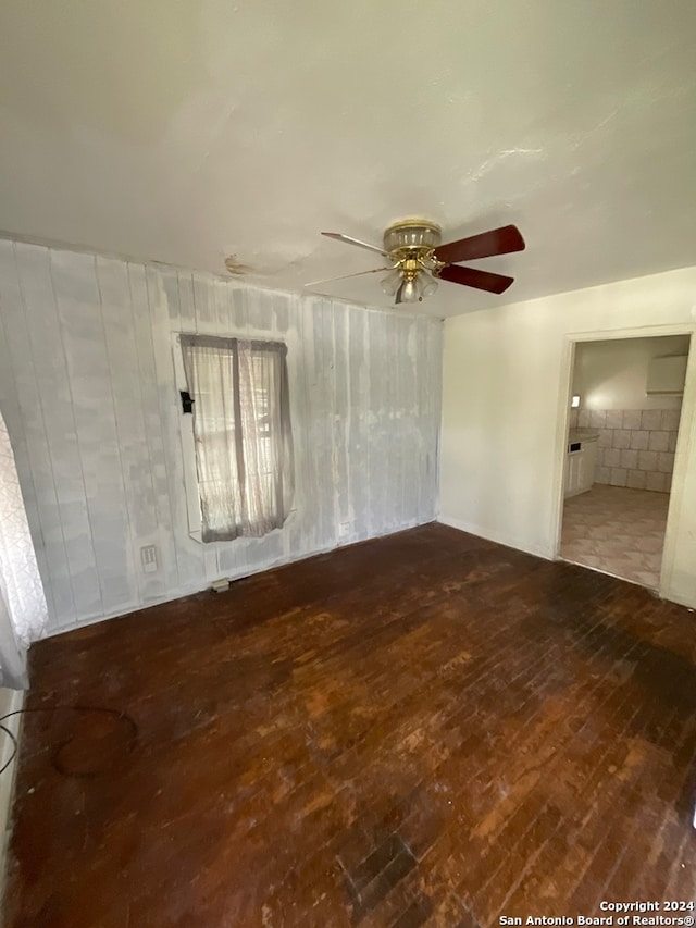 spare room featuring hardwood / wood-style flooring and ceiling fan