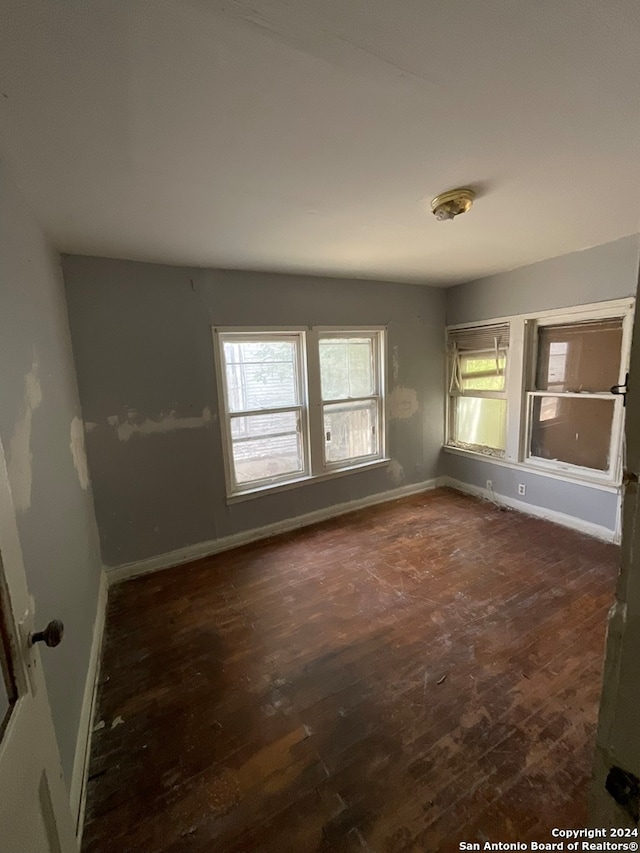 unfurnished room featuring hardwood / wood-style floors