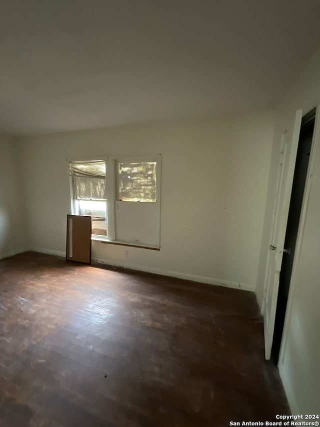 empty room with concrete flooring