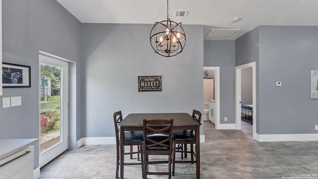 dining area with a notable chandelier