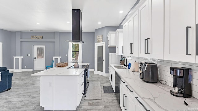 kitchen with white cabinetry, island range hood, a kitchen island, and electric range oven