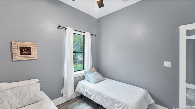 bedroom featuring hardwood / wood-style floors and ceiling fan