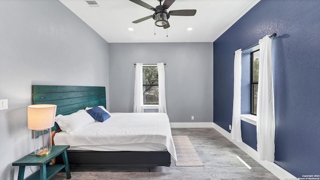 bedroom featuring hardwood / wood-style flooring and ceiling fan