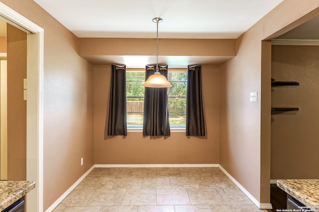 unfurnished dining area with light tile patterned floors