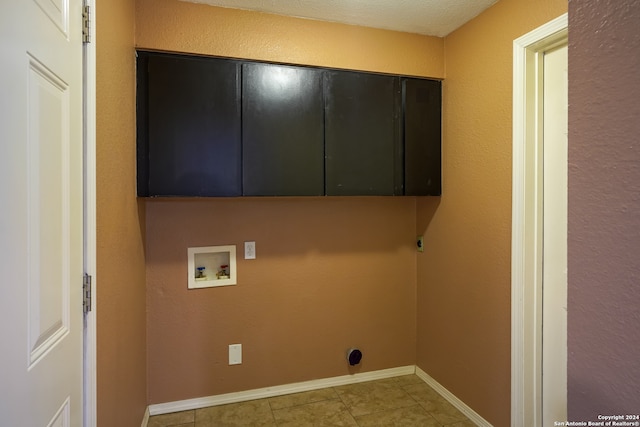 laundry room with cabinets, washer hookup, and light tile patterned flooring