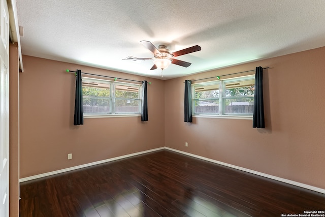 empty room with wood-type flooring, a textured ceiling, and ceiling fan