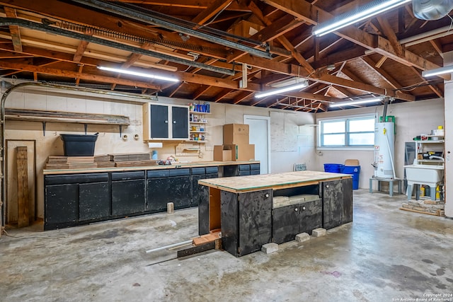 basement with sink and gas water heater