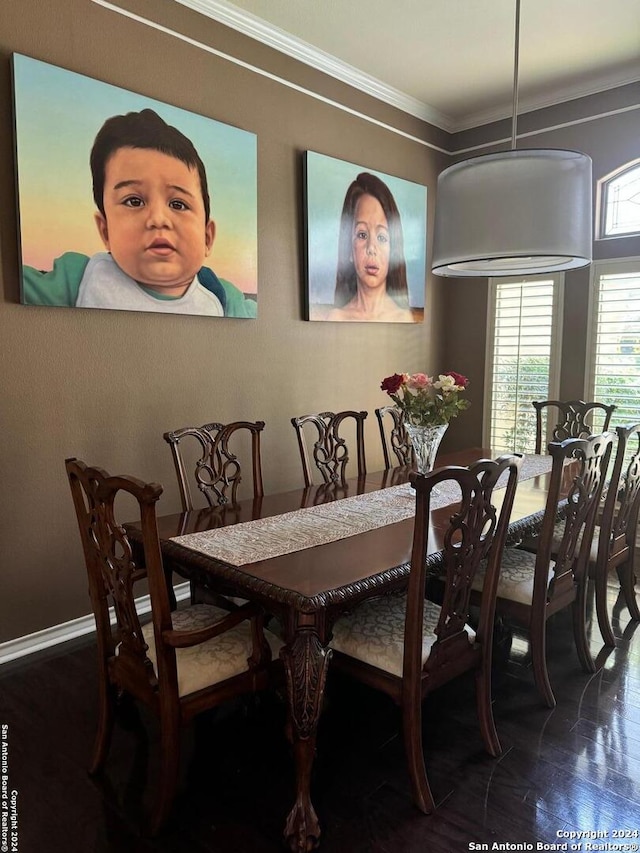 dining area with crown molding and wood-type flooring