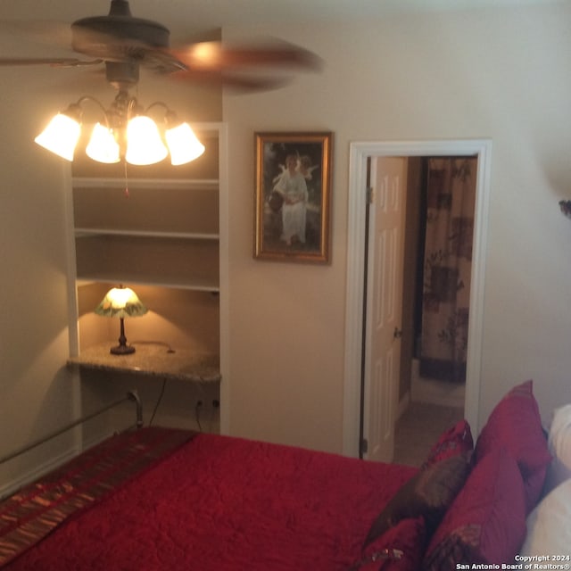 bedroom with carpet flooring and a notable chandelier