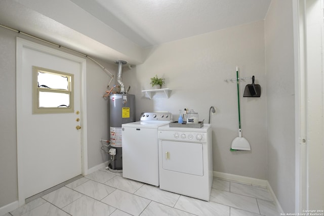 laundry room with independent washer and dryer and gas water heater