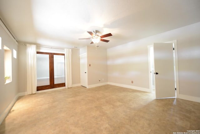 unfurnished room with light tile patterned floors, a textured ceiling, ceiling fan, and french doors