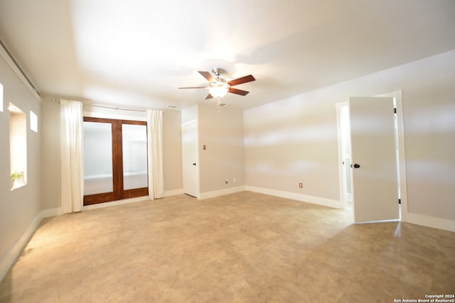 spare room with french doors and ceiling fan