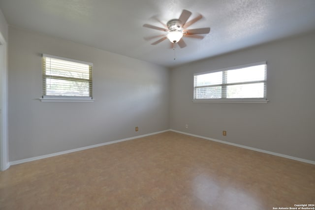 spare room featuring ceiling fan