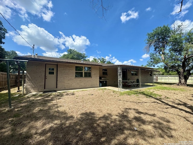 back of house featuring a patio area