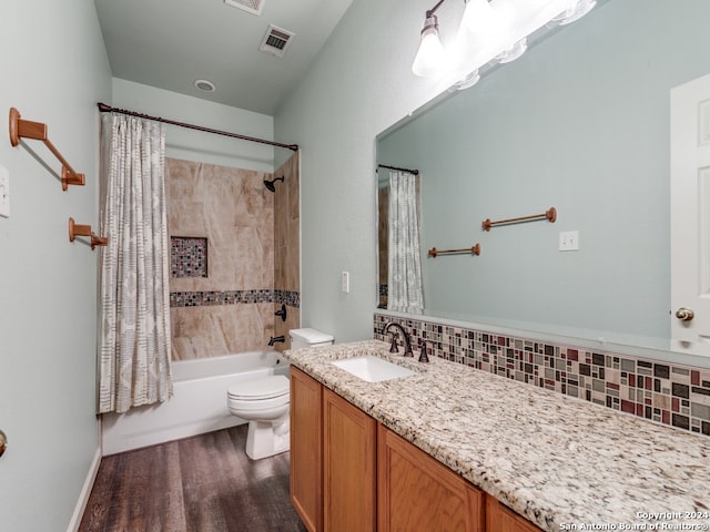 full bathroom with toilet, vanity, wood-type flooring, decorative backsplash, and shower / bath combination with curtain