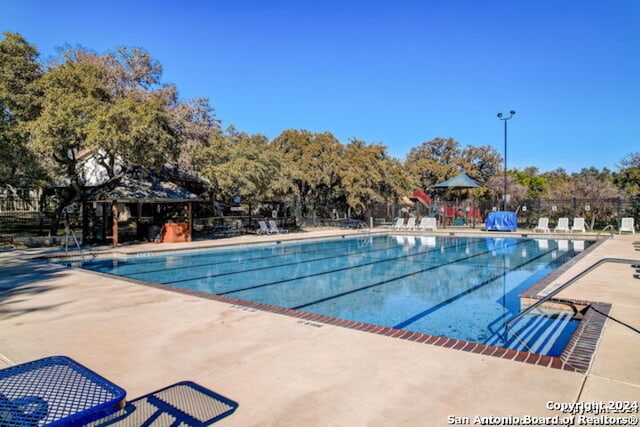 view of swimming pool featuring a patio