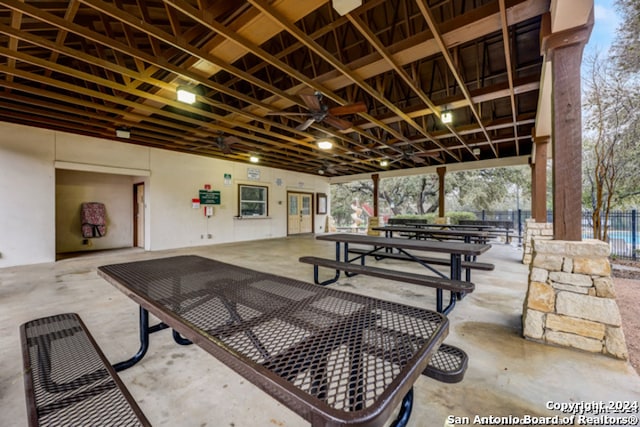 exterior space featuring outdoor dining area, a patio area, and fence