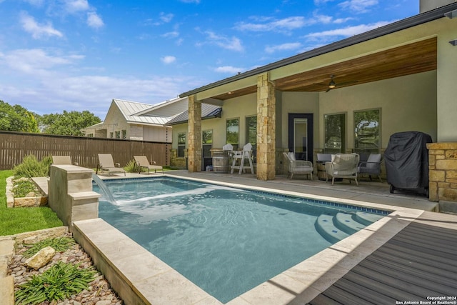 view of swimming pool with a fenced in pool, a ceiling fan, a patio, and fence