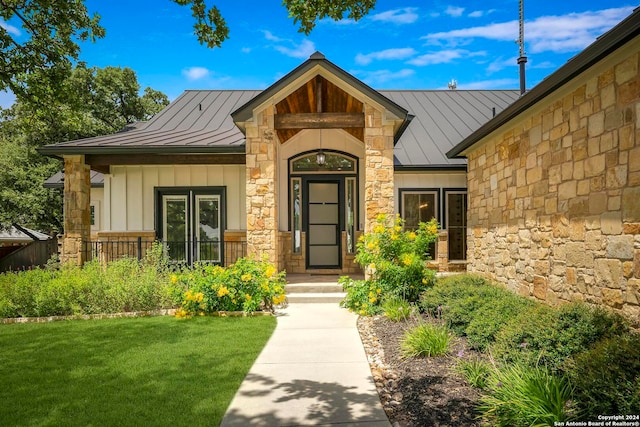 entrance to property with a yard