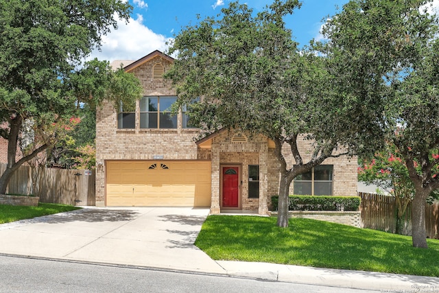 view of front facade featuring a garage and a front lawn