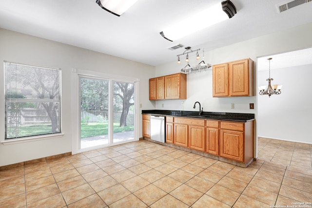 kitchen featuring a chandelier, dishwasher, light tile patterned floors, and pendant lighting