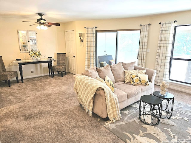 living room featuring carpet and ceiling fan