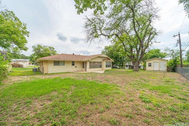 rear view of house with a yard