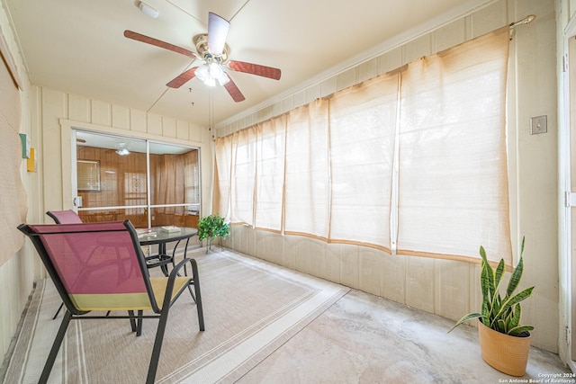 sunroom featuring ceiling fan