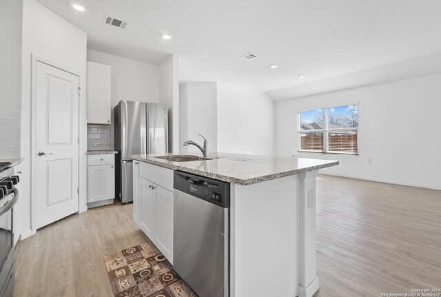 spare room featuring light hardwood / wood-style flooring