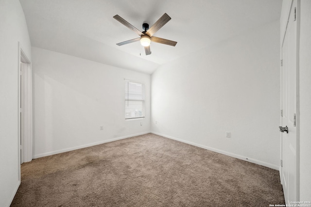 spare room with carpet, lofted ceiling, and ceiling fan