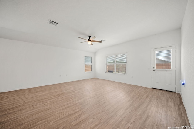 spare room featuring light hardwood / wood-style floors and ceiling fan