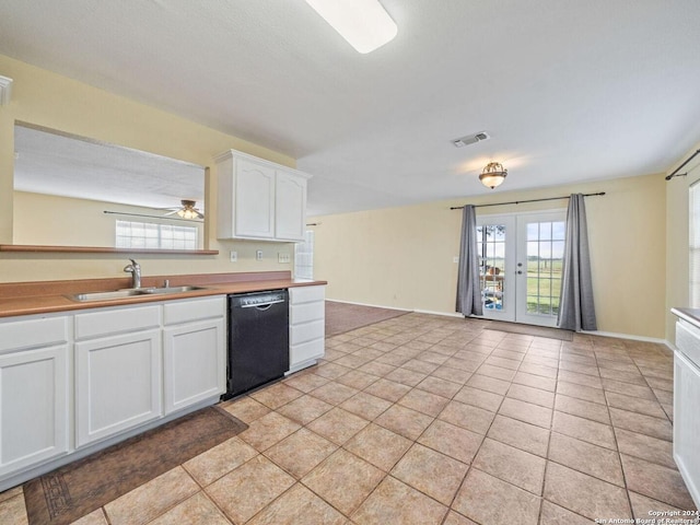 kitchen with white cabinets, sink, dishwasher, french doors, and light tile patterned floors