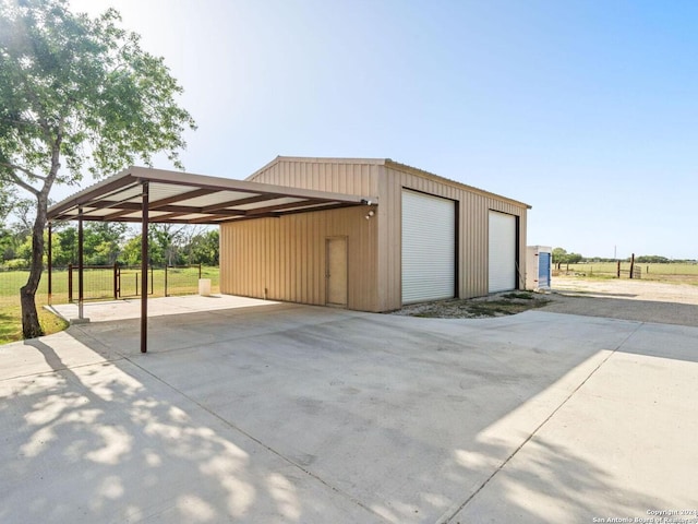 garage featuring a carport