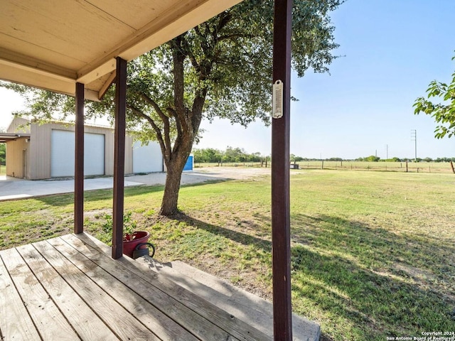 exterior space with a rural view and a garage