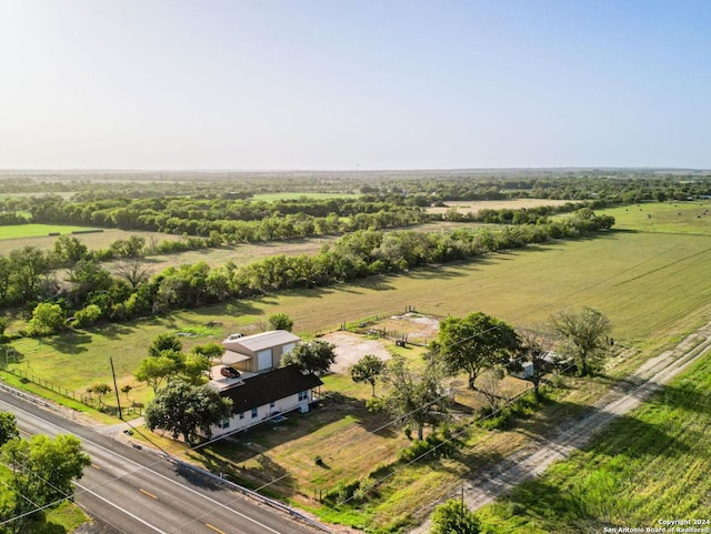 birds eye view of property with a rural view