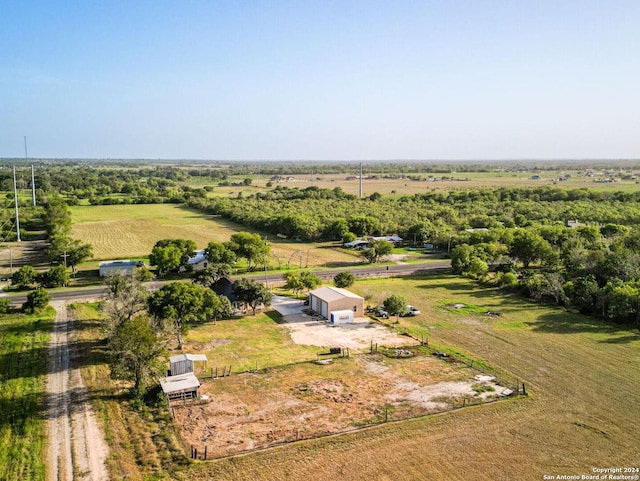 birds eye view of property featuring a rural view