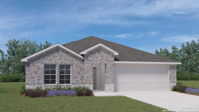 view of front of property with a garage and a front yard