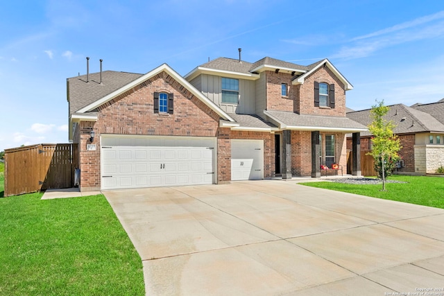 view of front facade with a garage and a front lawn