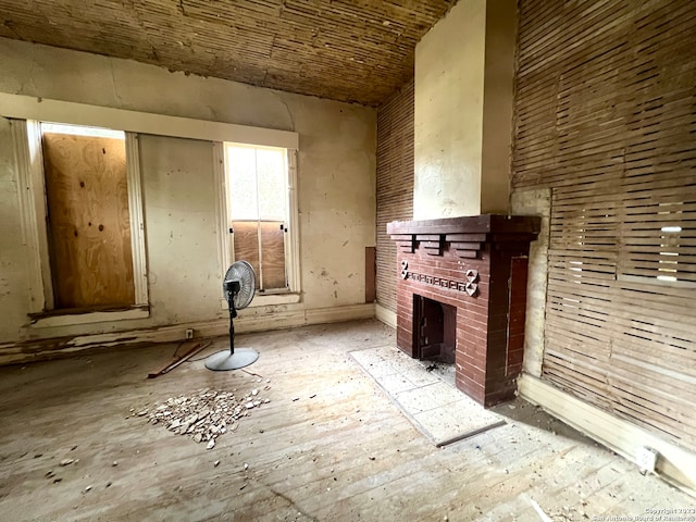 unfurnished living room with a brick fireplace