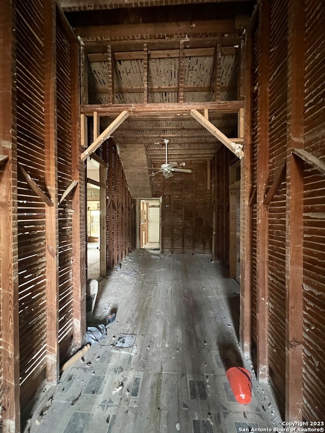 interior space with ceiling fan