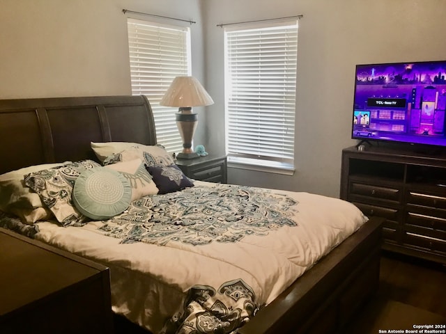 bedroom featuring dark hardwood / wood-style flooring