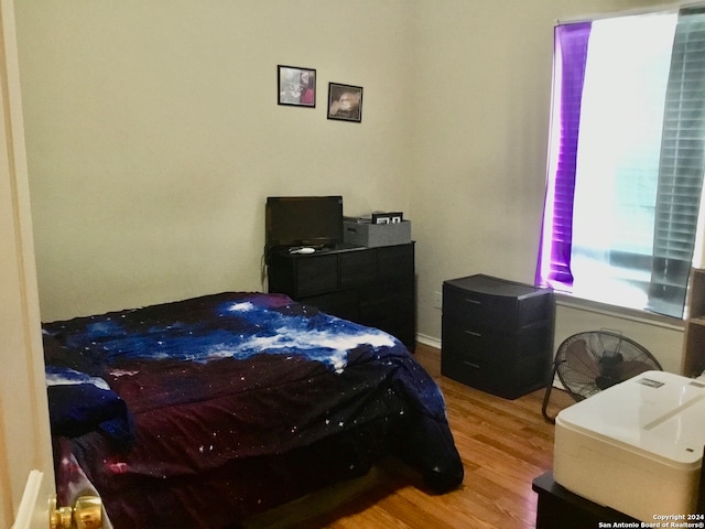 bedroom with light hardwood / wood-style flooring