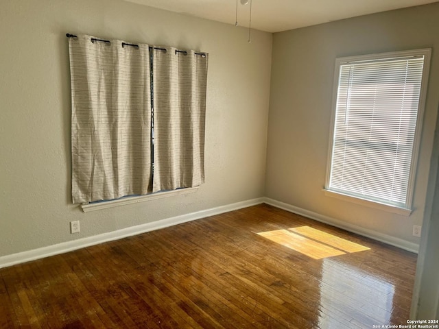 spare room featuring hardwood / wood-style flooring