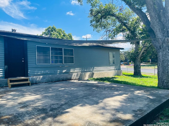 view of home's exterior with a patio