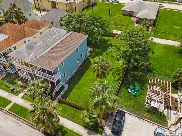 view of front of property featuring a balcony and a lawn