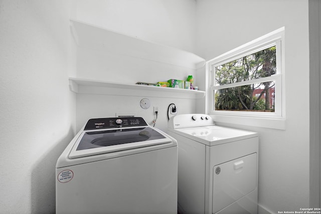 laundry area with separate washer and dryer