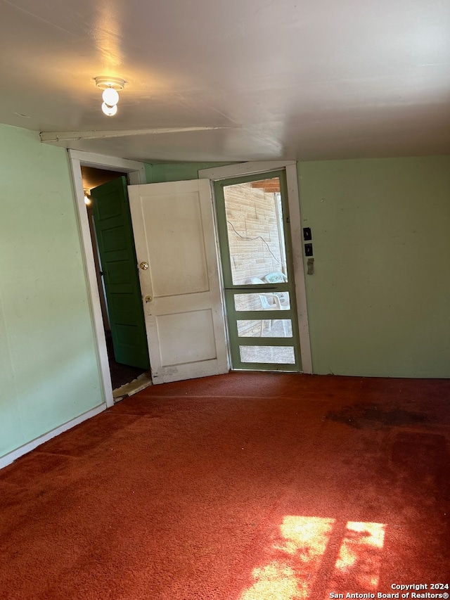 spare room featuring carpet