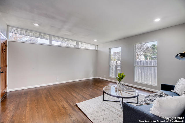 living room with dark hardwood / wood-style floors