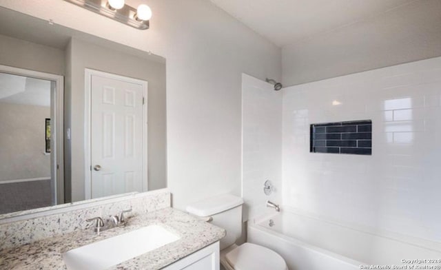 full bathroom featuring vanity, toilet, and tiled shower / bath